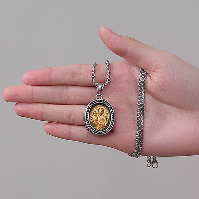 Collier en titane avec pendentif Médaille du Christ Saint dorée