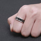 Anillo giratorio con bordes escalonados cruzados de titanio negro/dorado