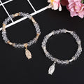 Pulsera de cuentas de vidrio transparente con colgante de la Virgen María