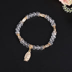 Pulsera de cuentas de vidrio transparente con colgante de la Virgen María
