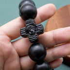 Pulsera de rosario de sándalo negro con cruz clásica de Jesucristo