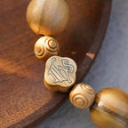 Chapelet portable élastique en bois d'olivier et perles roses