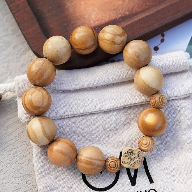 Chapelet portable élastique en bois d'olivier et perles roses