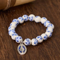 Pulsera floral con cuentas azules y blancas con Medalla Milagrosa
