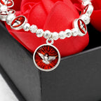 Bracelet Esprit Saint en émail avec croix et perles de roses : Symbole précieux de protection divine
