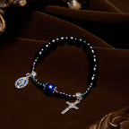 Bracelet avec Notre-Dame et crucifix en ébène et agate bleue