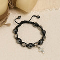 Bracelet en perles d'hématite avec croix et Saint Benoît : Solennel rappel des racines spirituelles