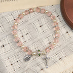 Pulsera elástica de cristal transparente moderno con crucifijo y medalla milagrosa: una declaración de fe contemporánea