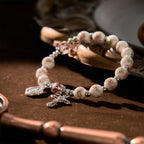 Bracelet élastique en céramique à fleurs multicolores avec médaille miraculeuse et crucifix : Élégance discrète de la foi