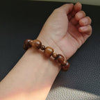 Bracelet en bois marron style classique avec crucifix INRI