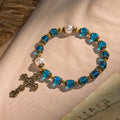 Bracelets de perles bleues brillantes spirituelles avec crucifix sacré en laiton