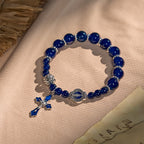 Élégants bracelets en perles bleu profond avec crucifix et médaille miraculeuse