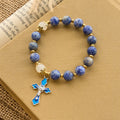 Pulsera Serene de Piedra Azul Texturizada con Crucifijo de Esmalte Azul