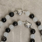 Bracelet chapelet animal Notre-Dame en perles avec chat-vache noir et blanc