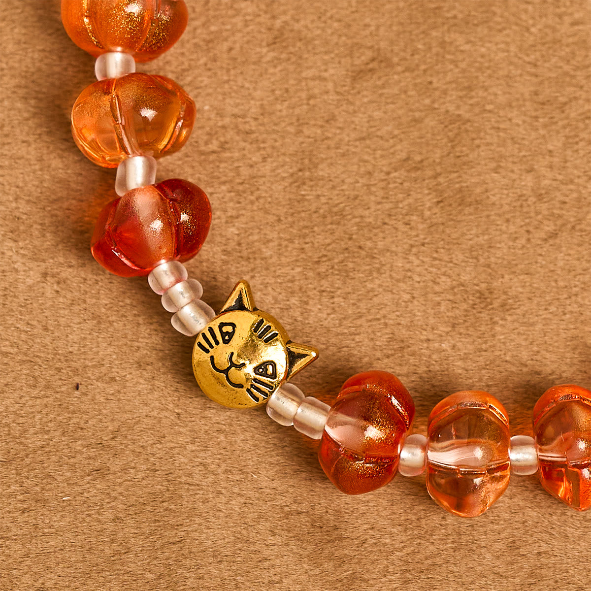 Rosario, pulsera con cuentas en forma de calabaza