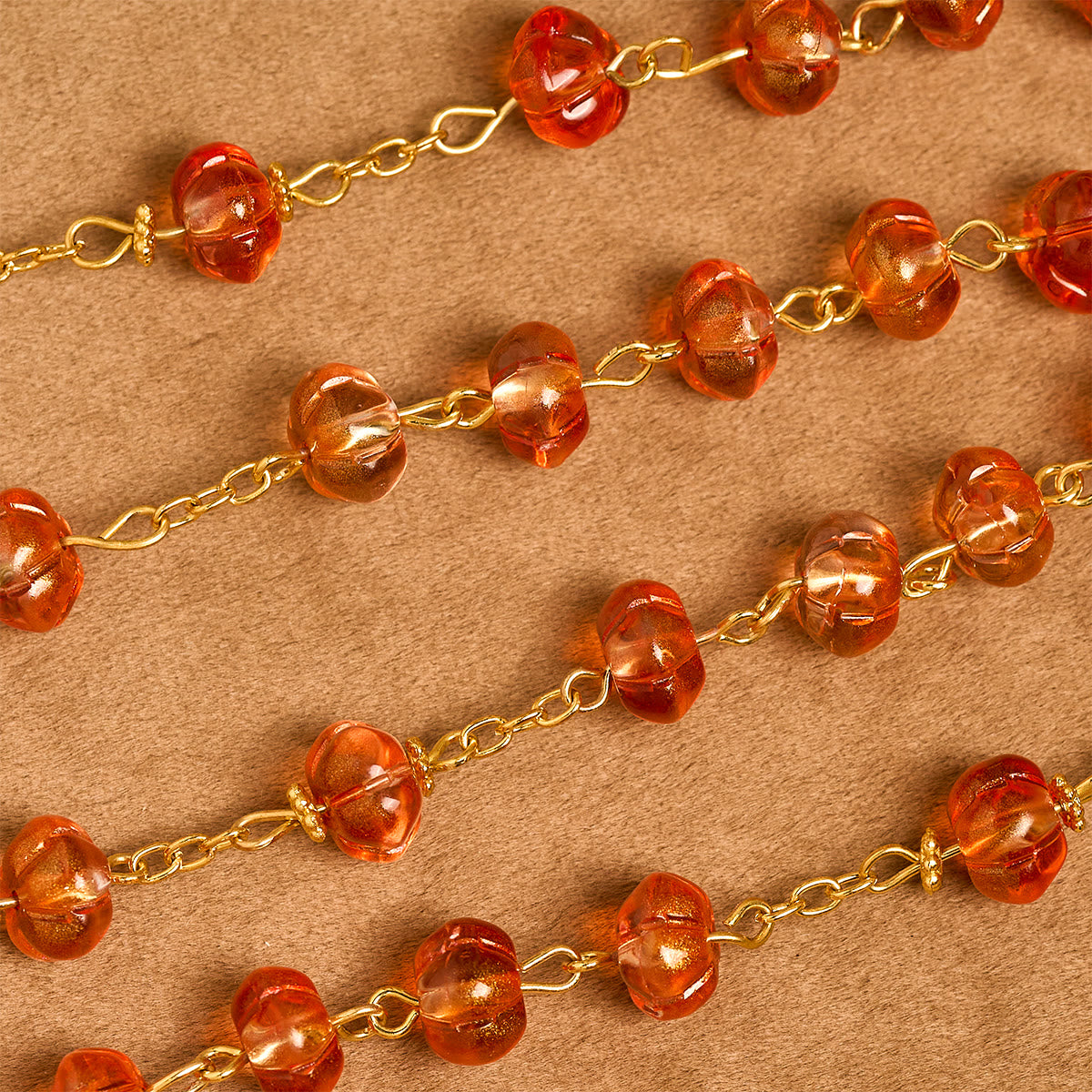 Rosario, pulsera con cuentas en forma de calabaza