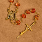 Rosario, pulsera con cuentas en forma de calabaza