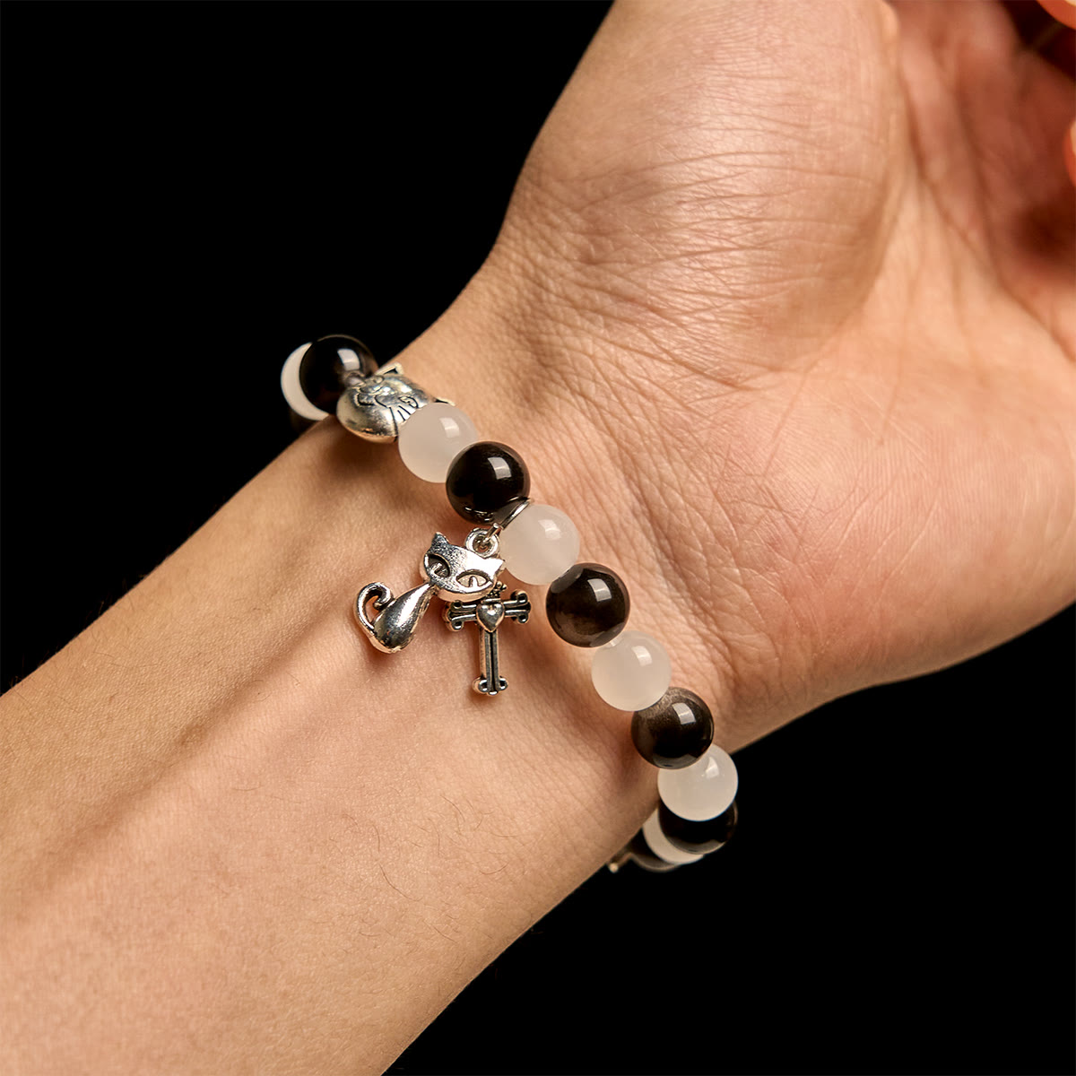 Bracelet chapelet animal Notre-Dame en perles avec chat-vache noir et blanc