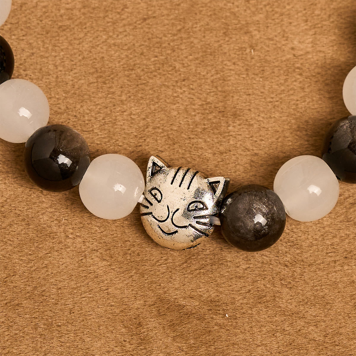 Bracelet chapelet animal Notre-Dame en perles avec chat-vache noir et blanc