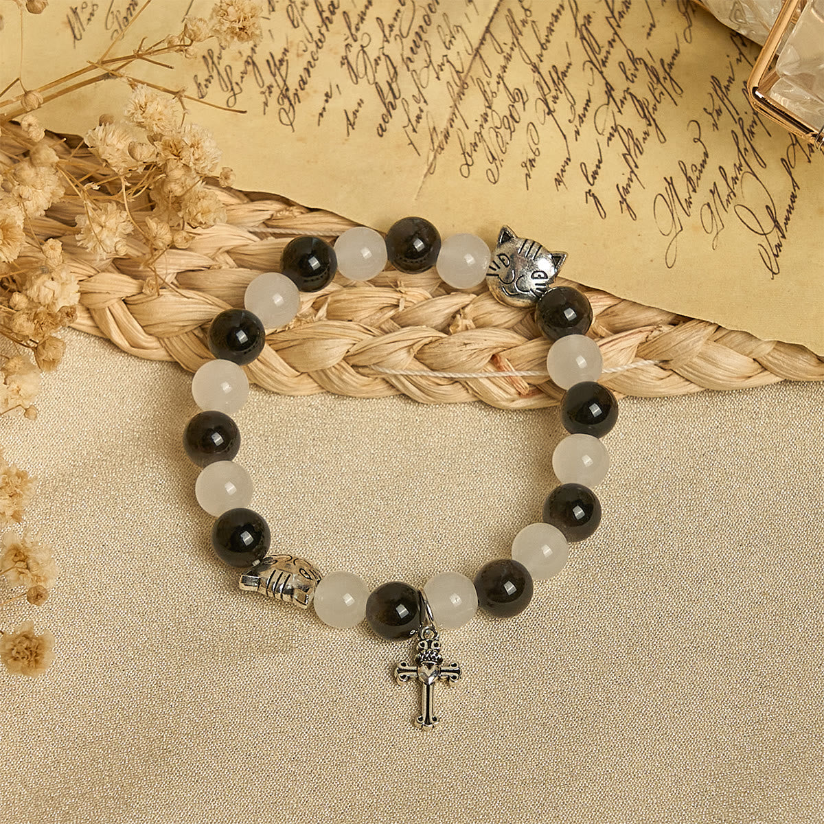 Bracelet chapelet animal Notre-Dame en perles avec chat-vache noir et blanc