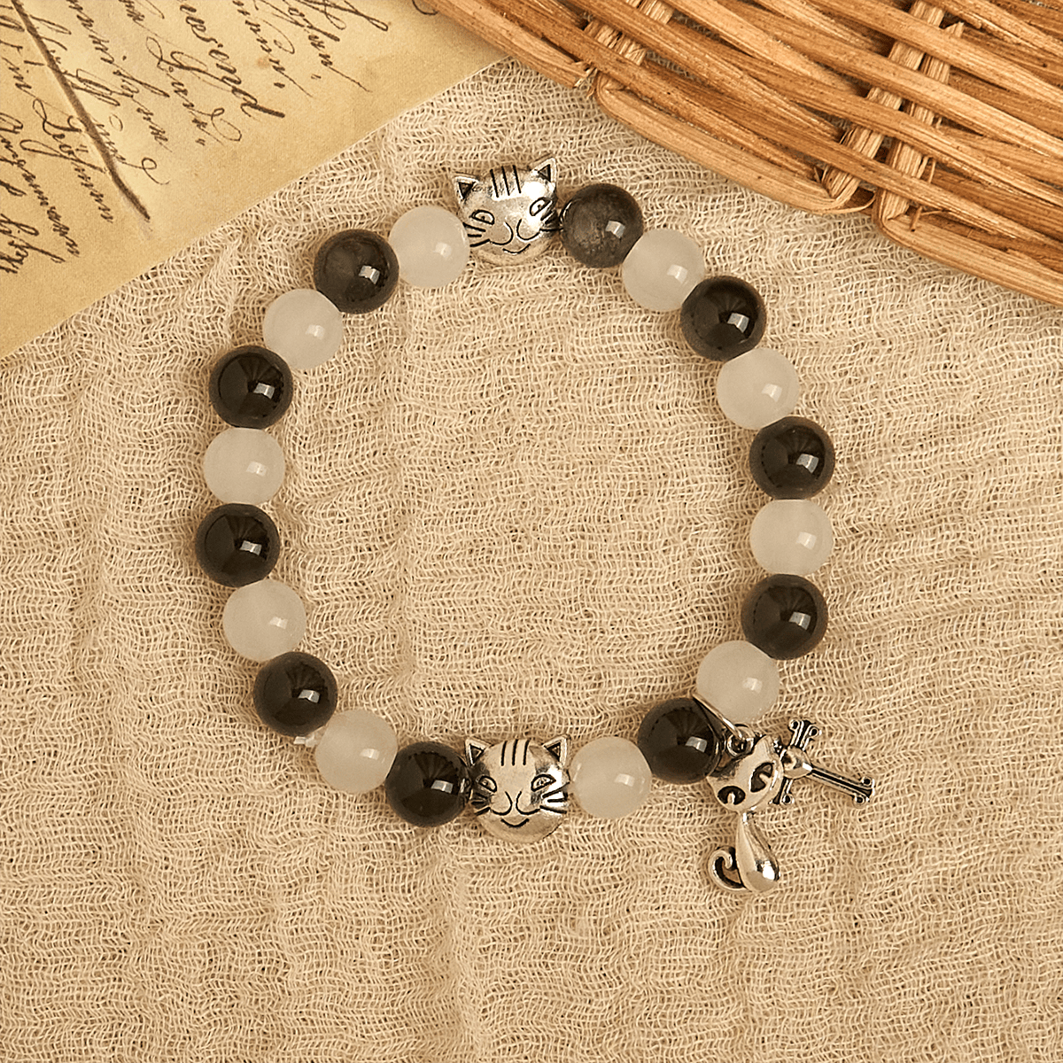 Bracelet chapelet animal Notre-Dame en perles avec chat-vache noir et blanc