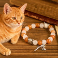 Bracelet animal chat tigré orange en quartz orange et blanc avec breloques en acier inoxydable tête de chat
