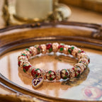 Pulsera de Cuentas Rojas Esmaltadas con Colgante de Cruz y Corazón