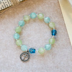 Bracelet de perles pailletées changeant de couleur aux UV avec croix ornée : Scintillez dans des tons de foi