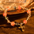 Bracelet perles roses en cristal et facettées avec crucifix doré : Une foi éblouissante pour votre style quotidien