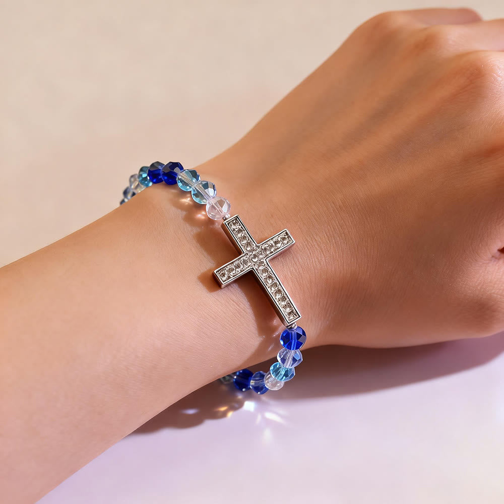Bracelet Croix Blanc & Bleu Paon : La Foi Enlacée de Reflets Scintillants