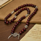 Pulsera de doble protección de cuentas de madera con San Benito y Medalla Milagrosa