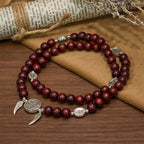 Pulsera de doble protección de cuentas de madera con San Benito y Medalla Milagrosa