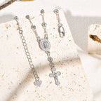 Bracelet pendentif Notre-Dame et Crucifix : Sa grâce à votre poignet