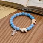 Bracelet en croix fait à la main « Ours polaire Perle bleue » : Sauvons nos ours polaires