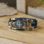 Pulsera de puño de cuero negro con múltiples diseños religiosos de la Colección San Benito