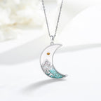 Collier graine de moutarde croissant de lune et croix : incrustation turquoise et finition argentée