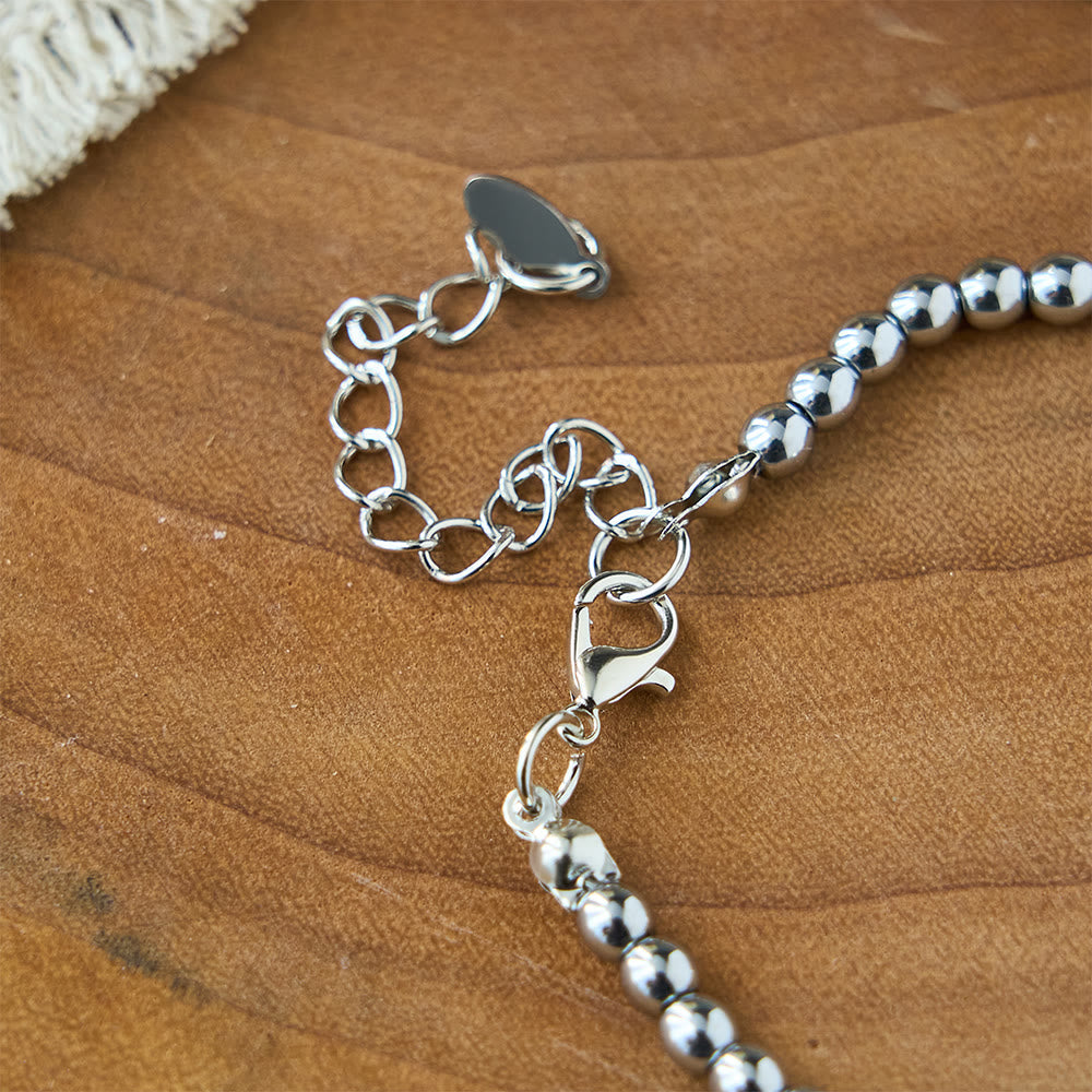 Pulsera de cuentas grabada "Fuerza y Coraje": Un símbolo de fuerza divina y coraje