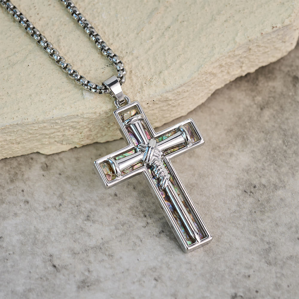 Collar con cruz de clavo con incrustaciones de nácar de abulón: un símbolo del amor sacrificial de Cristo
