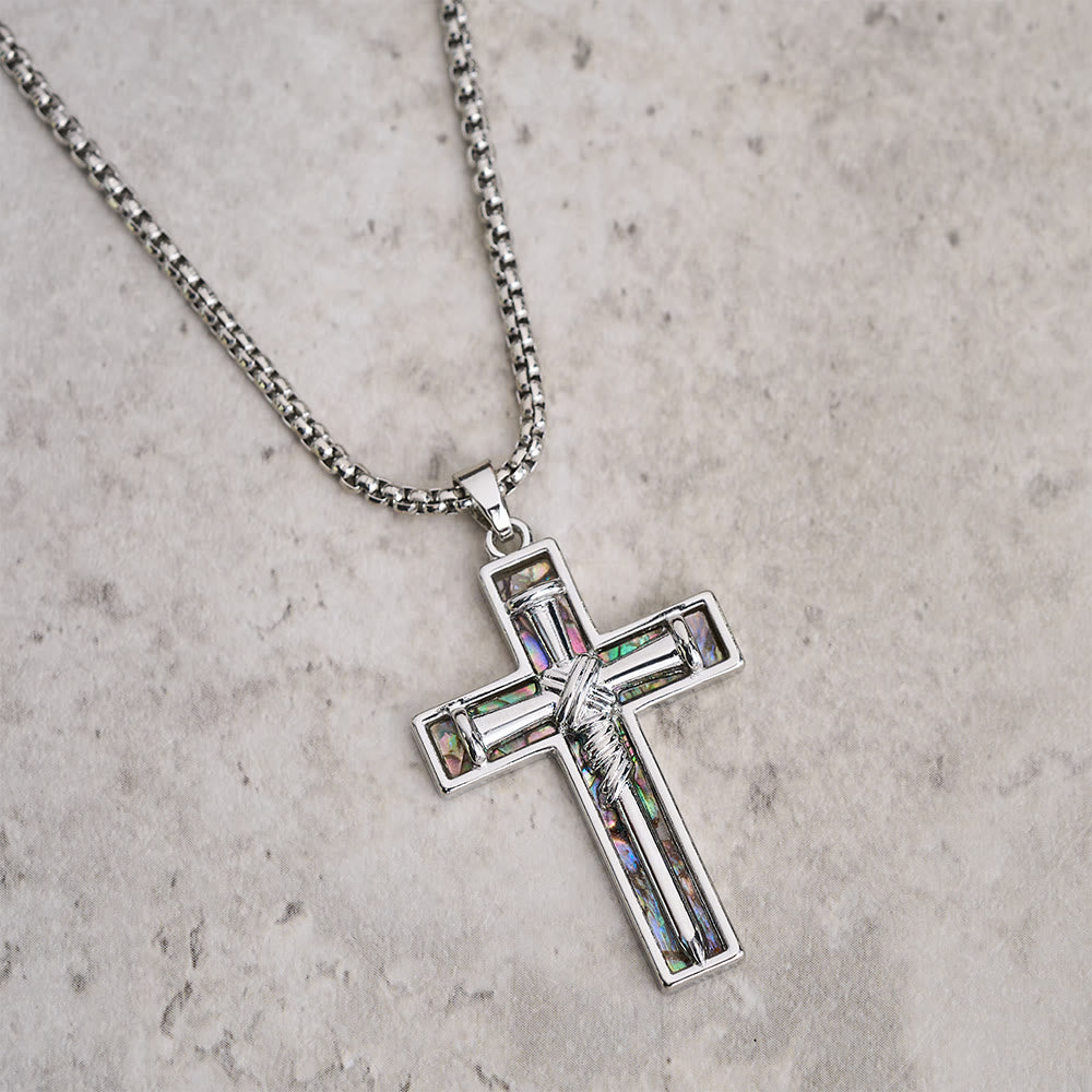 Collar con cruz de clavo con incrustaciones de nácar de abulón: un símbolo del amor sacrificial de Cristo