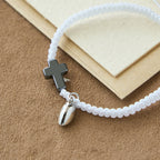 Juego de pulseras magnéticas con cruz de corazón: un símbolo de unión sagrada y amor duradero