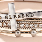 Pulsera de cuero de capas múltiples BLESSED con cruz y circonitas: un símbolo de gracia divina y alegría espiritual