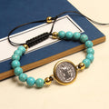 Bracelet perlé de prière et bénédiction Saint Benoît turquoise