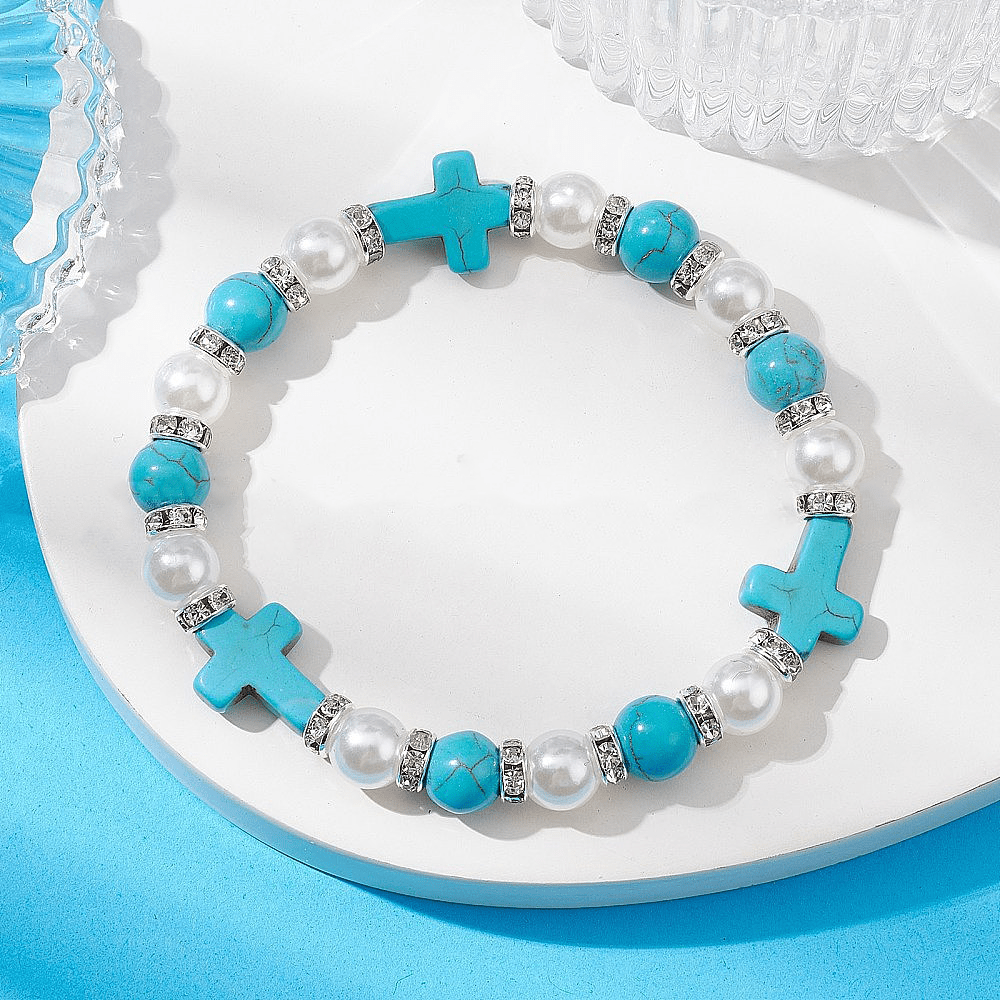 Pulsera de energía curativa con cruz de perlas y turquesas