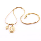 Collier en or double pendentif Notre-Dame rond